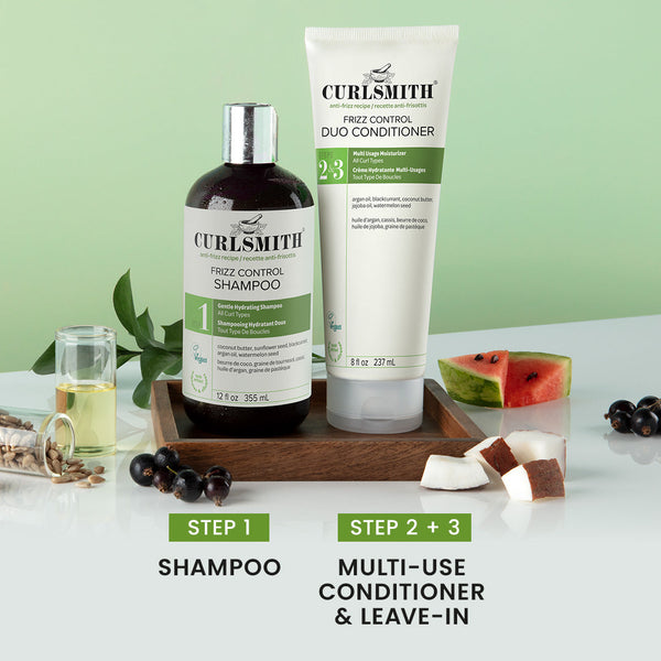 Curlsmith frizz control shampoo and conditioner bottles with step-by-step instructions on a white surface with green background