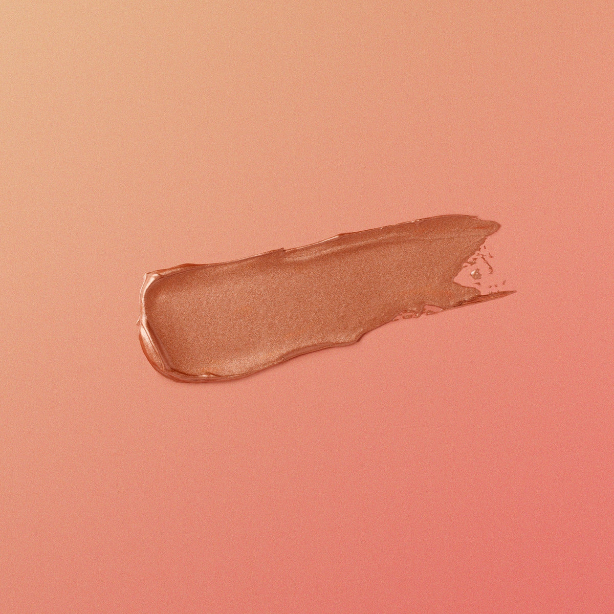 rose-gold-colored makeup swatch on a matching pink background