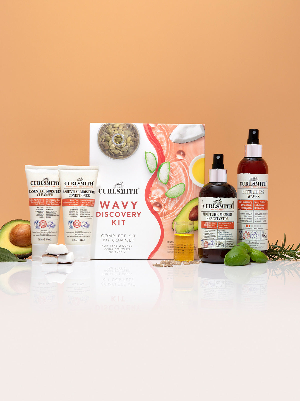 A product image featuring various wavy hair hair care items including bottles and tubes, arranged against an orange-themed background.