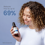 Woman holding a bottle of hair product with text claiming to reduce frizz by up to 69% on a blue background.