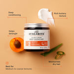 Curlsmith Double Cream Deep Quencher jar with apricot and aloe vera on a beige background