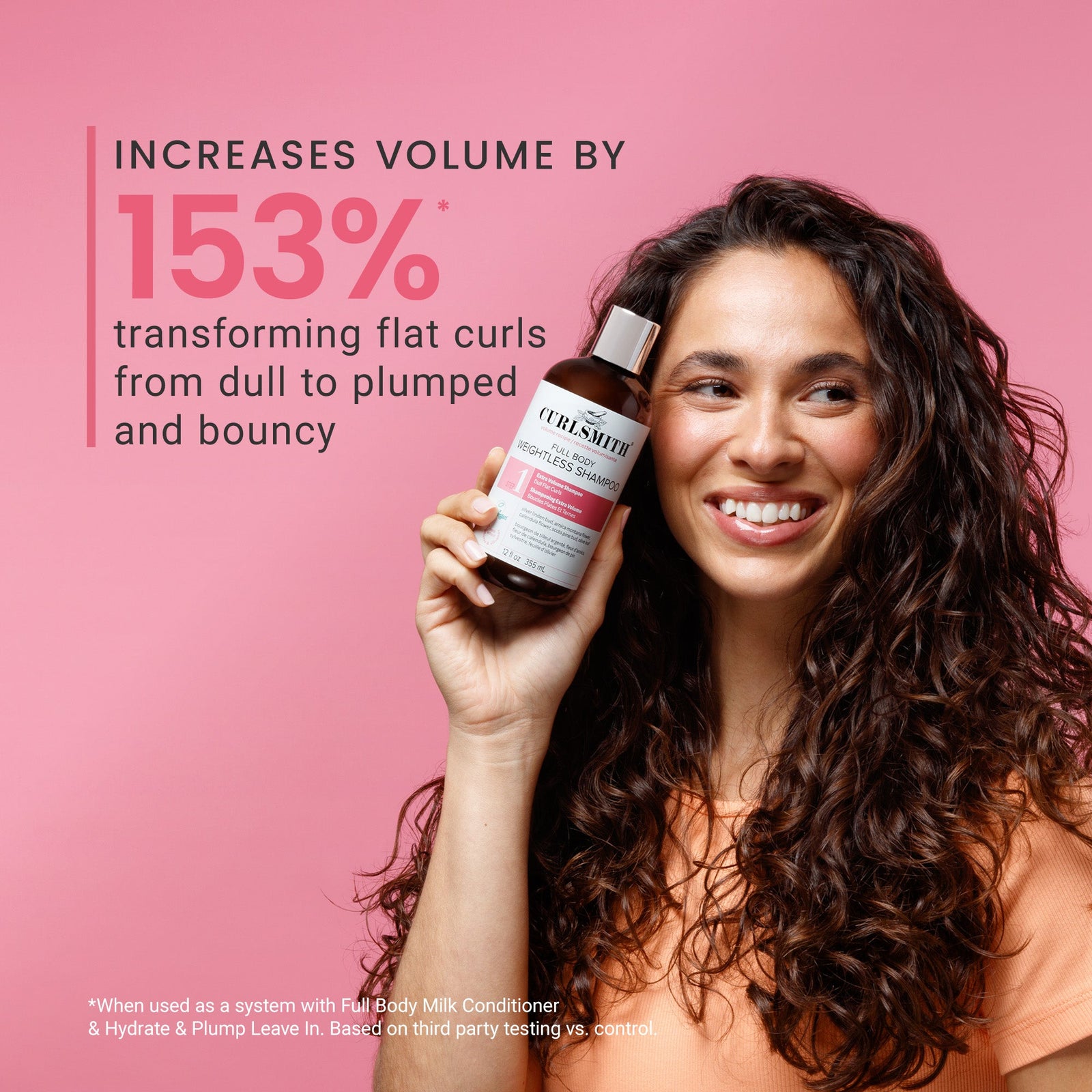 Woman holding a bottle of Curlsmith Full Body Weightless Shampoo with text on a pink background