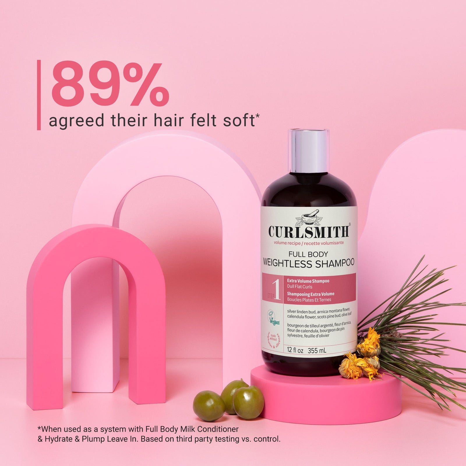 Curlsmith Full Body Weightless Shampoo bottle on a pink background with text about hair softness.