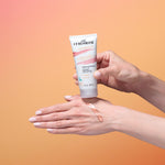 Person applying Curlsmith hair make-up product to their hand against a gradient background