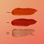 Three swatches of different colored lipsticks labeled 'Copper', 'Ruby', and 'Rose Gold' on a peach background.