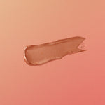 rose-gold-colored makeup swatch on a matching pink background