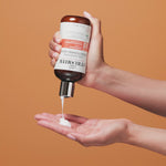Curl quenching conditioning wash bottle squeezed into hand