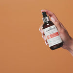 Hand spraying Moisture Memory Release into the air