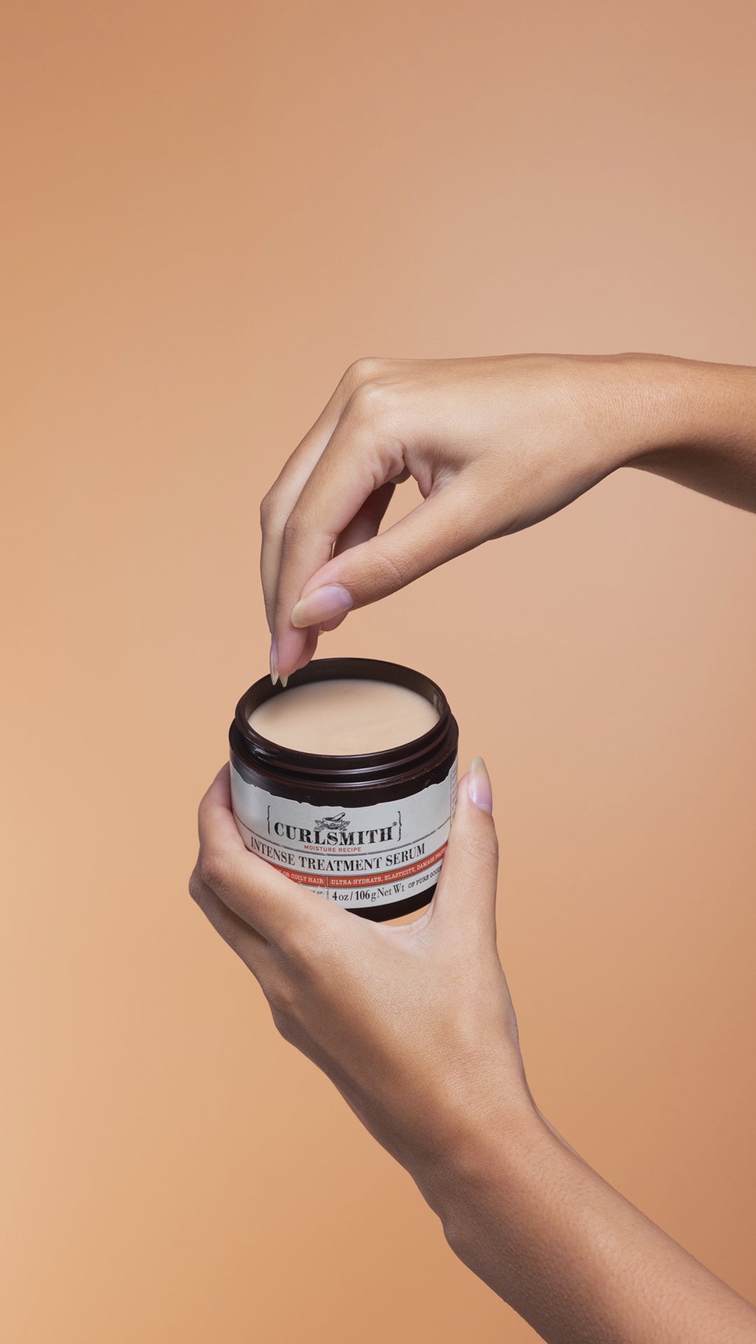 Hand dipping into Intense Treatment Serum
