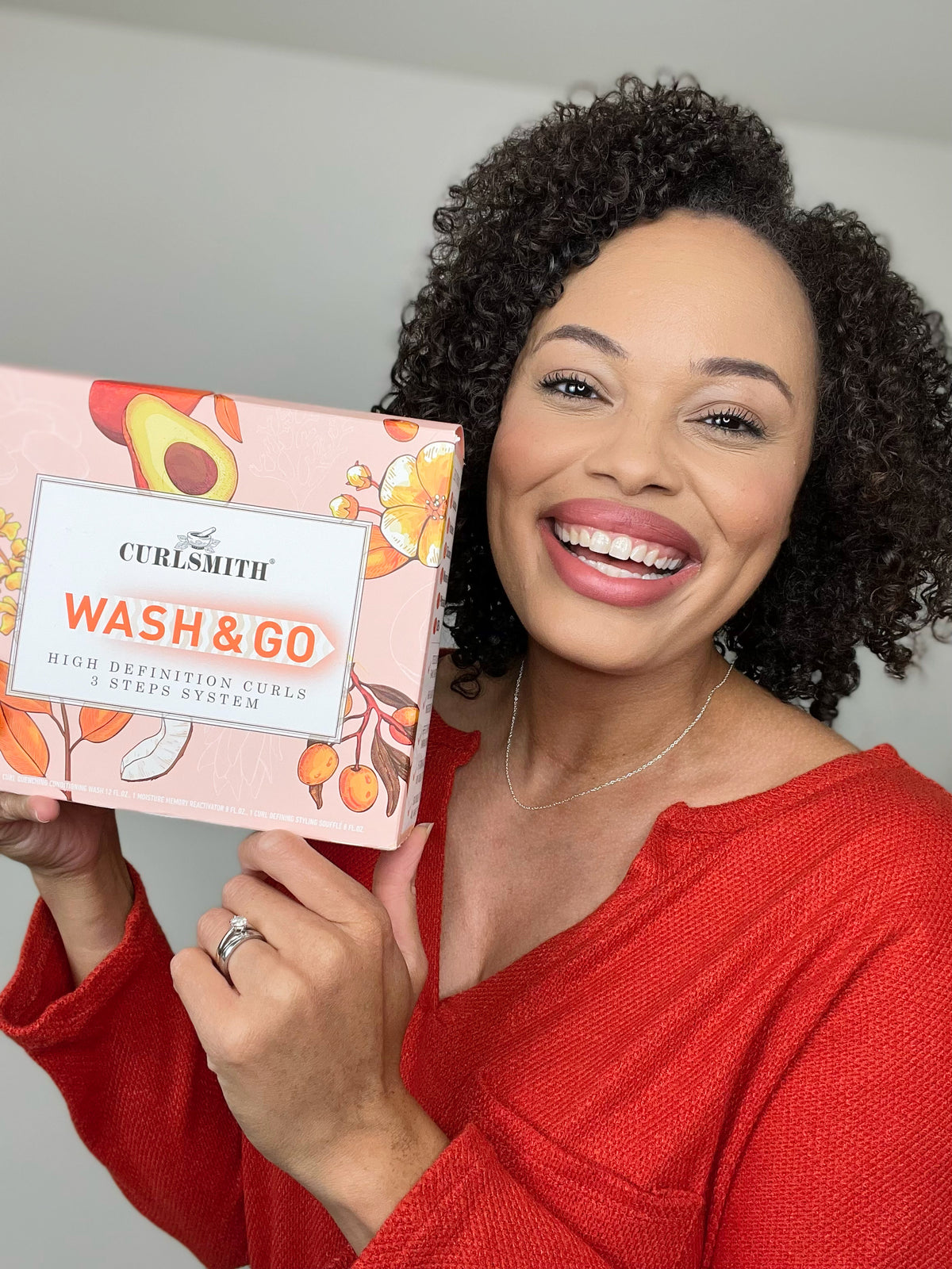 Woman holding wash & go kit