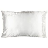 A white satin pillowcase on a pillow, with a subtle sheen.