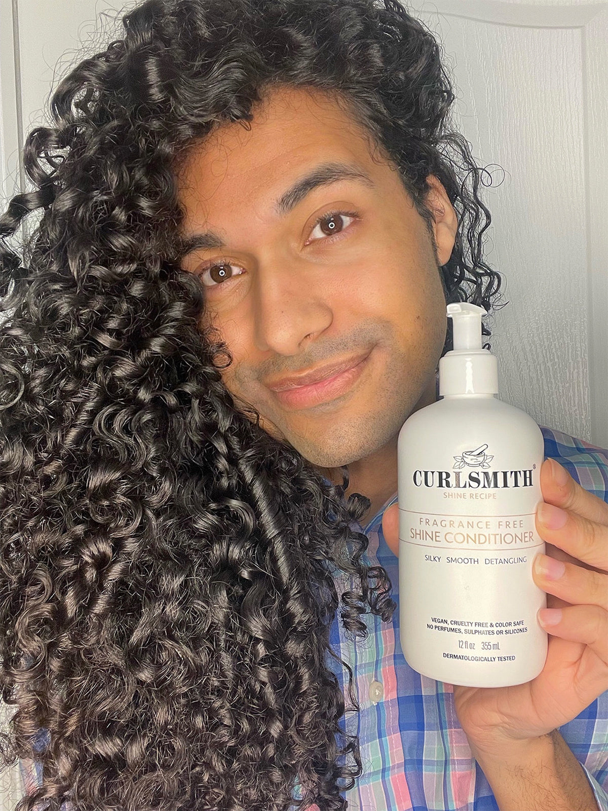 man holding shine conditioner 